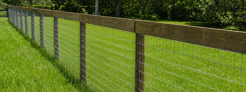 No-climb wire horse fence with pressure-treated wood posts on a Williston, Florida farm — Penrod Lumber & Fence serving Marion County and North Central Florida