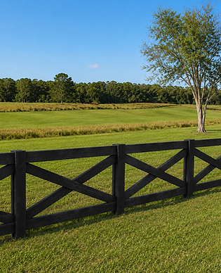 Decorative black crossbuck horse fence on a green Florida pasture — Penrod Lumber & Fence, Marion County