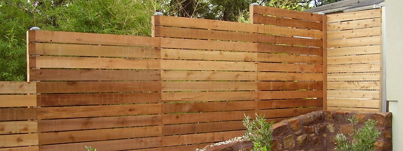 custom horizontal wood fence in a backyard in Silver Springs