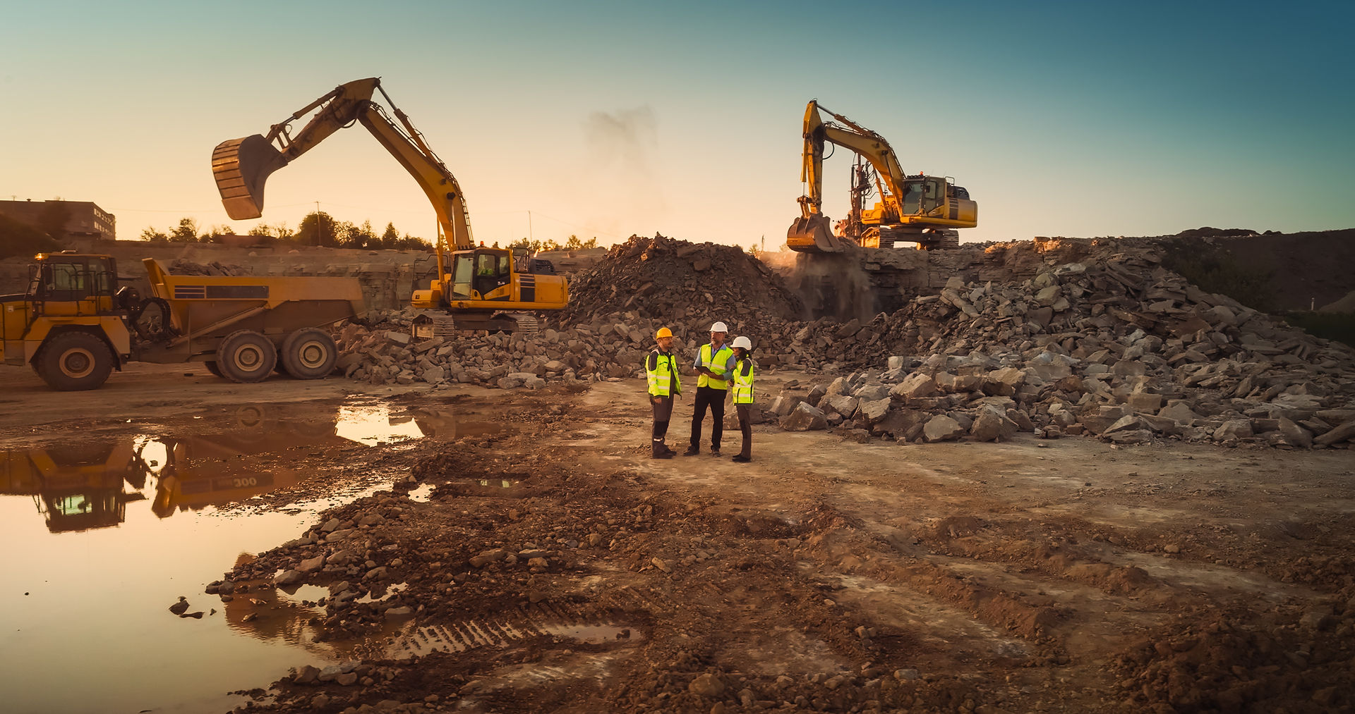 construction site with workers and equipment