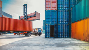 Shipping containers in port yard
