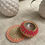 Thumbnail: pink diya with cream and pink zari coaster