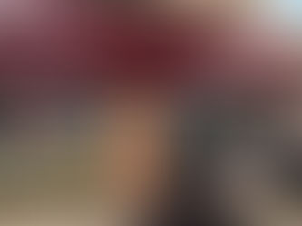 Plywood board-up covering damaged storefront door at Frederick, MD convenience store