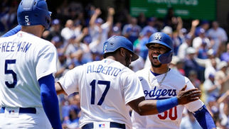 Dodgers players Freeman, Alberto, and Mookie Betts celebrating a Dodgers win
