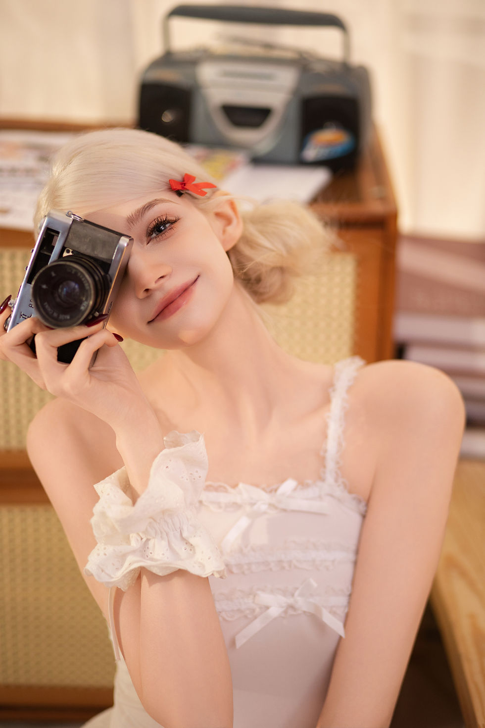 Ariana Hardie posing with a camera