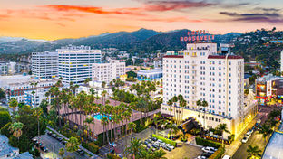 A beautiful day in July overlooking the Hollywood Roosevelt hotel and Tropicana Pool agains the backdrop of Los Angeles at sunset