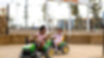Children riding mini tractors at Pa’s Pumpkin Patch