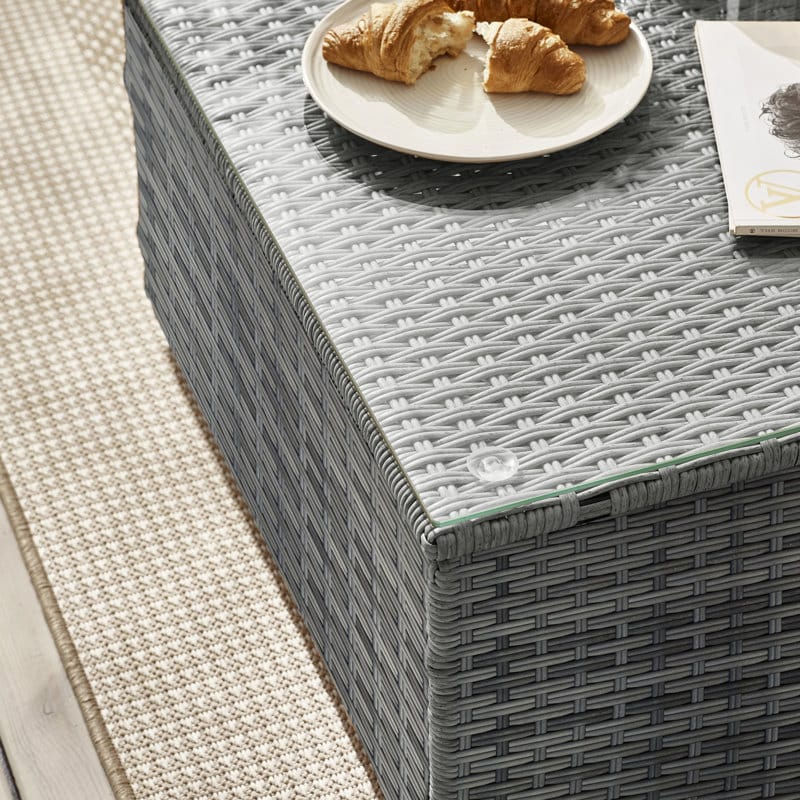 Thumbnail: View of top corner of coffee table showing the clear glass