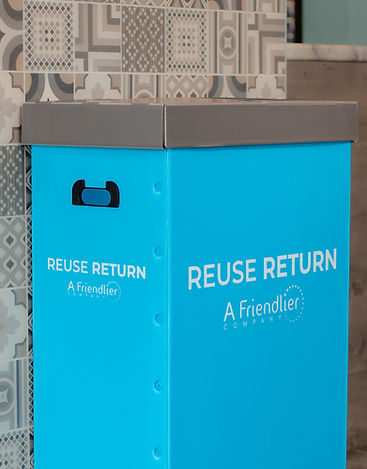 Friendlier return bin in a restaurant, against a tiled wall
