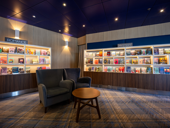 library with romance and mystery section, and two chairs