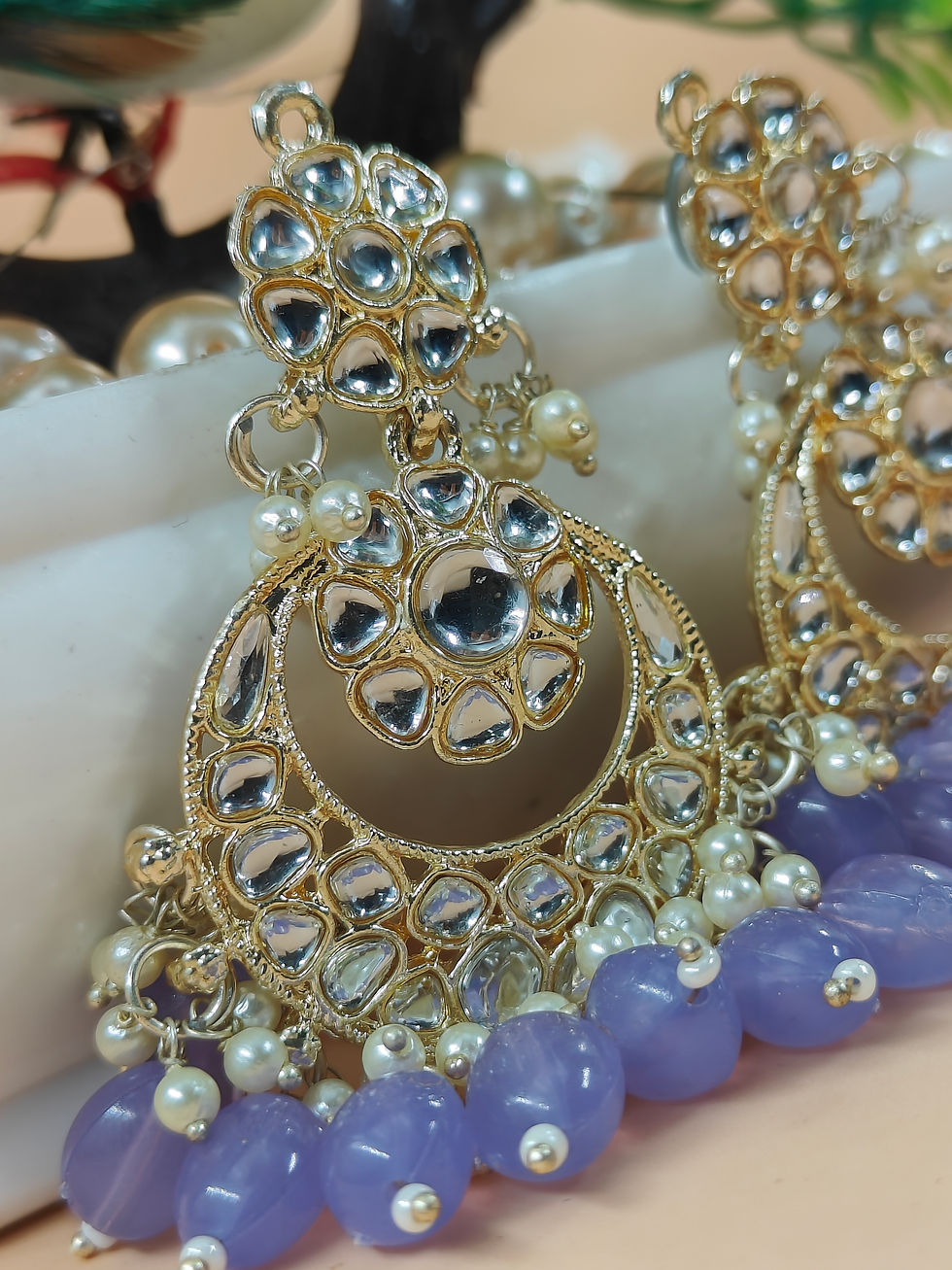 earrings are worn as talismans for protection or as expressions of religious or spiritual beliefs.