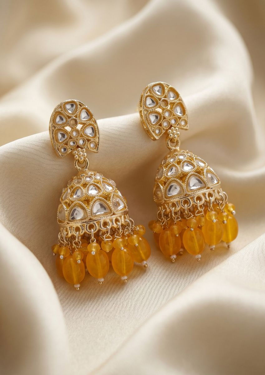 Jhumki-style earrings showcase the skilled craftsmanship and artistic expression of jewelry artisans.