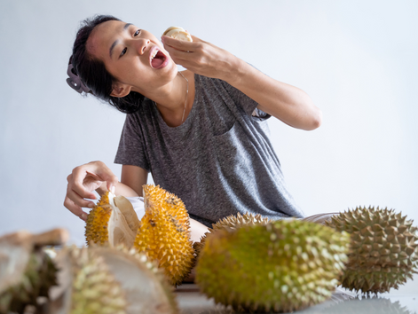 A Girl Eating Durian