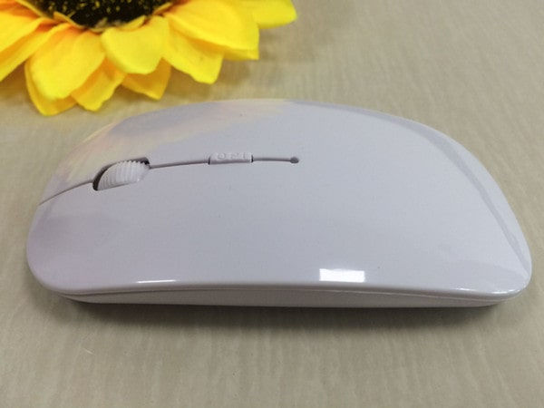 Thumbnail: White ultra thin 2.4 USB wireless mouse beside a flower
