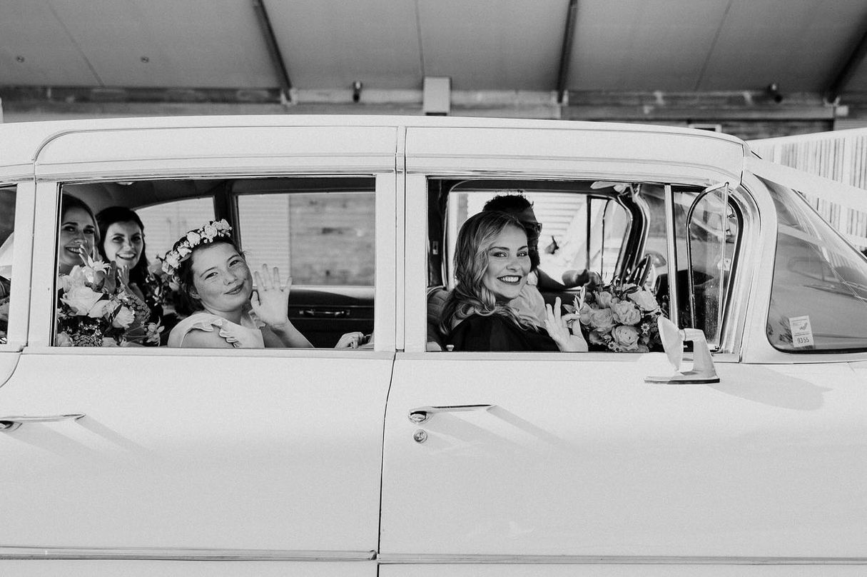 Brides maids in the Fleetwood Limousine black and white