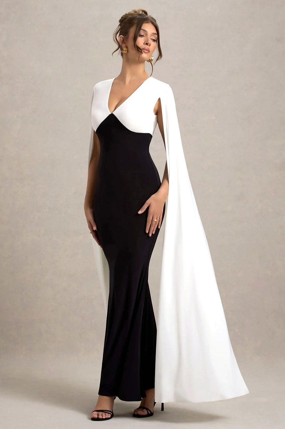 Thumbnail: Robin Plunge Neck Maxi Dress – a stunning, floor-length dress with a deep neckline, perfect for evening events.