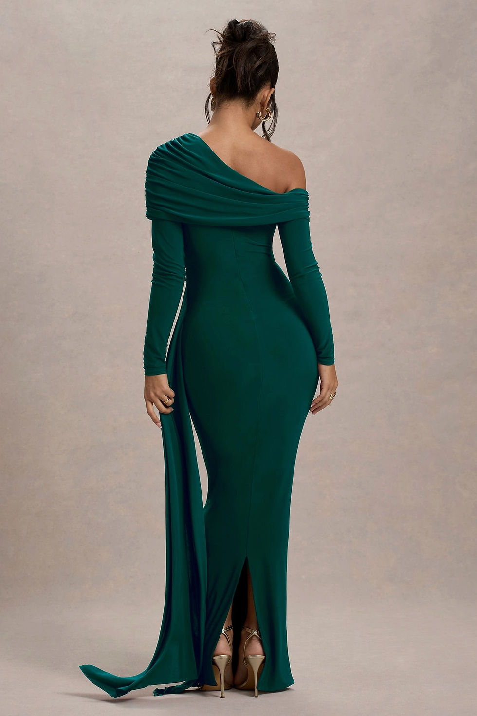 Model wearing a luxurious velvet one-shoulder drape maxi dress with full sleeves and figure-hugging silhouette.