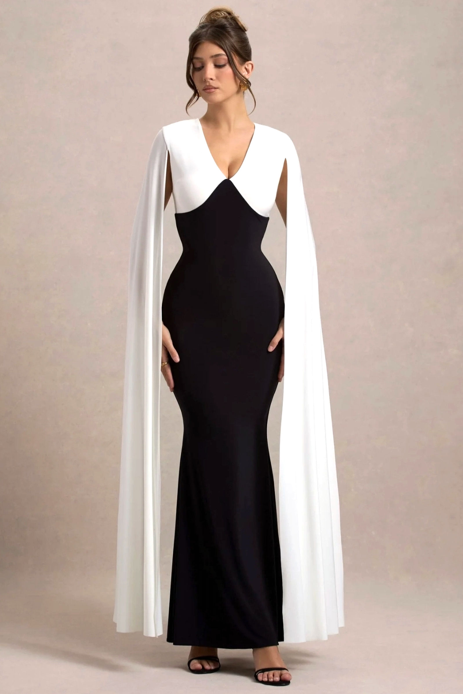 Robin Plunge Neck Maxi Dress – a stunning, floor-length dress with a deep neckline, perfect for evening events.