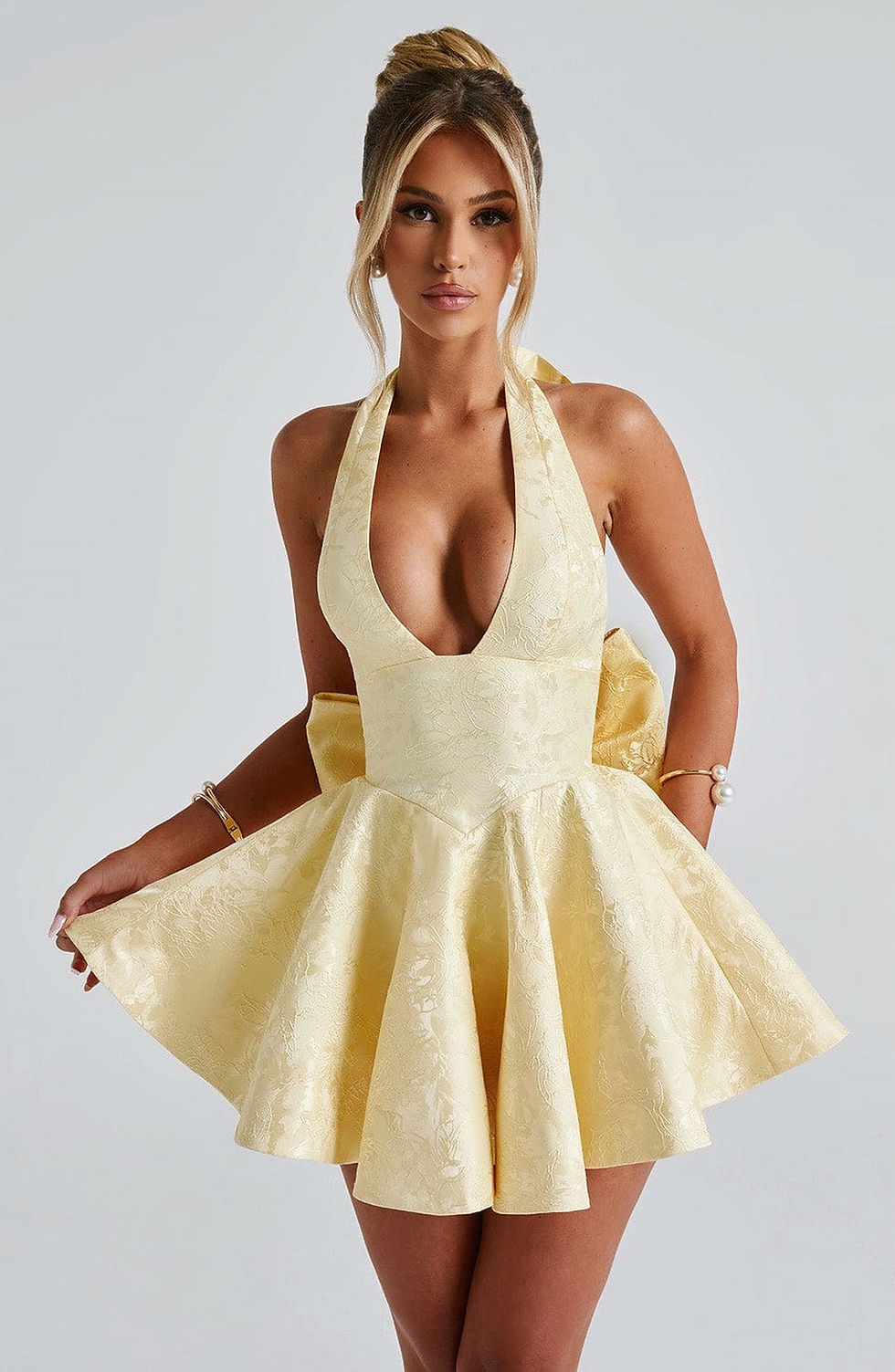 Thumbnail: Anna – A cute and chic mini dress with a halter neck and bow detail, perfect for daytime outings, date nights and parties.