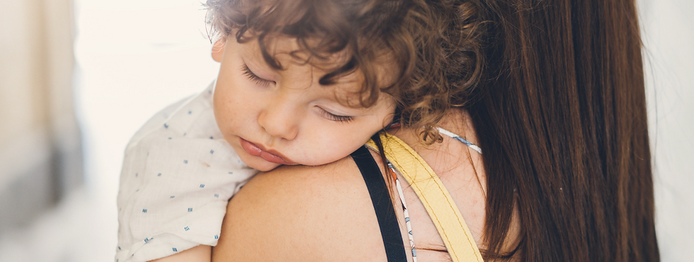 toddler-2-year-sleep-regression.jpg Parent comforting a toddler during a 2 year sleep regression.