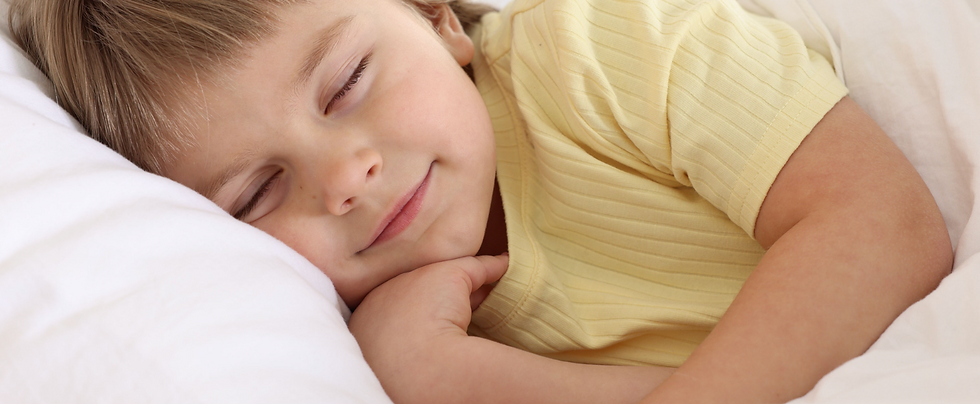 Toddler girl sleeping peacefully after a calming bedtime routine.