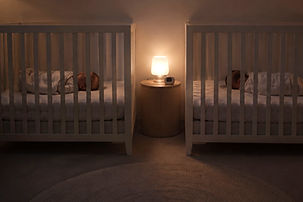 Twins room sharing safely in individual cots
