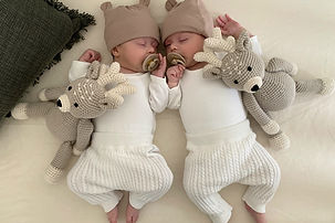 Twin babies sleeping peacefully as part of a healthy bedtime routine