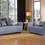Thumbnail: Blue sofa and loveseat in a bright, modern living room with large windows.