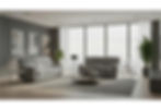 Grey reclining sofas in a modern living room with large windows.