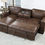 Thumbnail: Brown faux leather sectional sofa with chaise, pull-out bed, and cup holders.