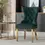 Thumbnail: Green velvet tufted dining chair with gold legs and studded trim.
