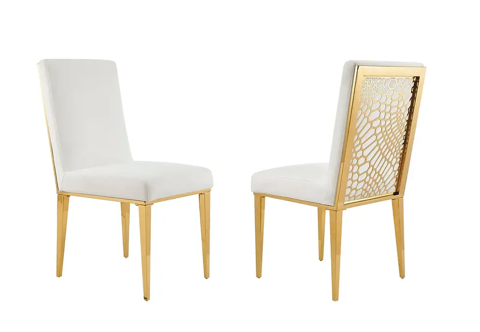 Thumbnail: Two white and gold dining chairs, one with a detailed leaf back.
