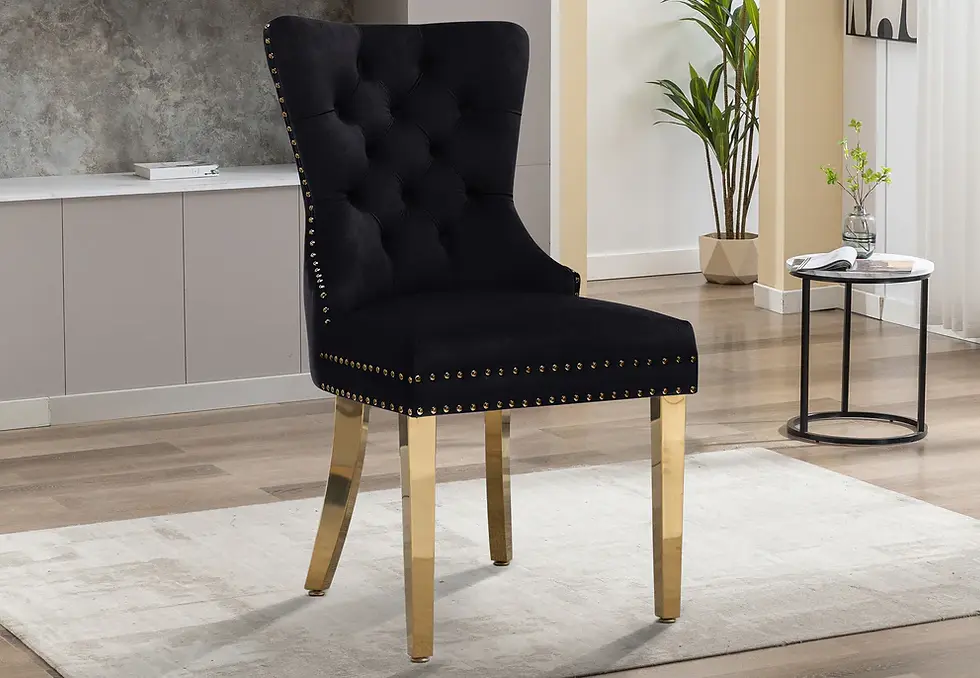Elegant black velvet tufted dining chair with stylish gold legs.