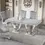 Thumbnail: Elegant marble dining table with silver base and grey chairs.
