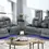 Thumbnail: Two grey power reclining sofas with blue LED underglow in living room.