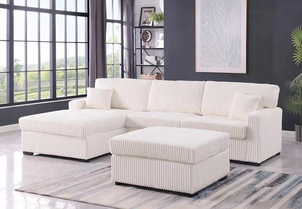 Thumbnail: Plush white sectional sofa with chaise and matching ottoman in living room.