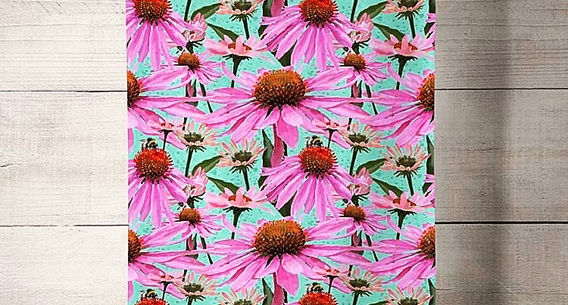 This image is of the repeating Echinacea pattern - Pink Polka. It is a piece of turquoise, pink and burnt orange patterned fabric on a beige background hanging from a washing line with a cream wooden background. The fabric could be used as a tea towel. 