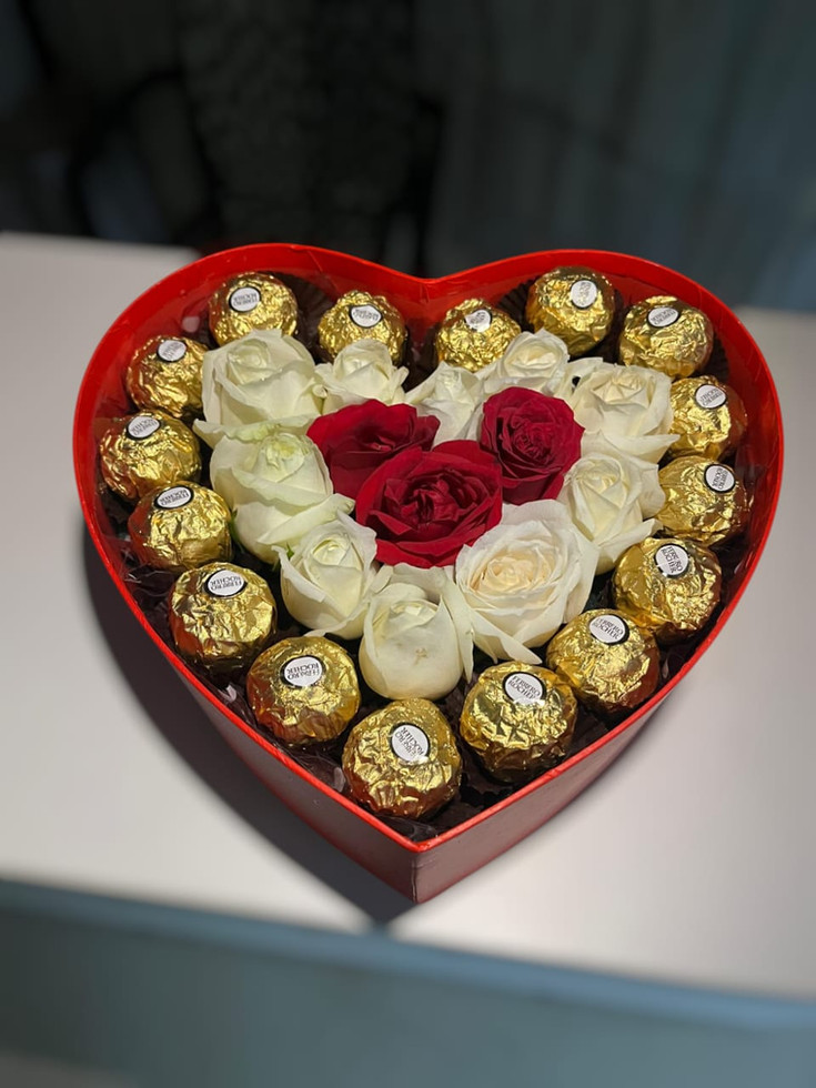 roses and ferrero in heart shape box with wings