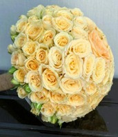 Bridal Flower Arrangement is a luxurious masterpiece featuring elegant roses.