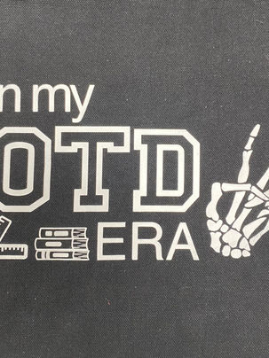 a black background with white/silver letters/images that says "In the OTD Era" with a hand made of bones in a piece sign, a small goniometer, and a stack of books. 