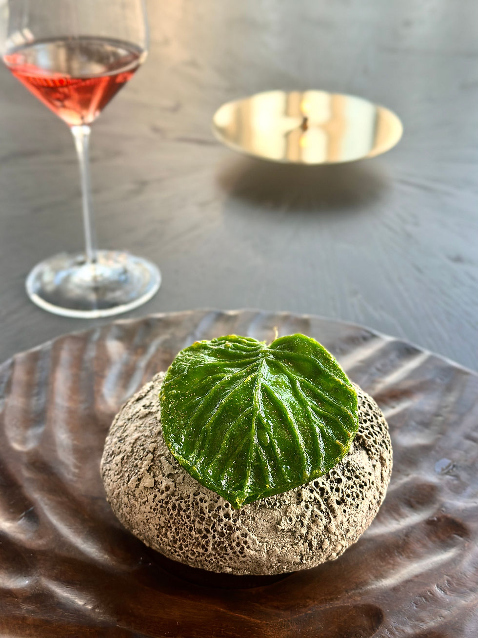 Green leaf seasoned with pine, filled with grilled oyster, scallops and fresh herbs