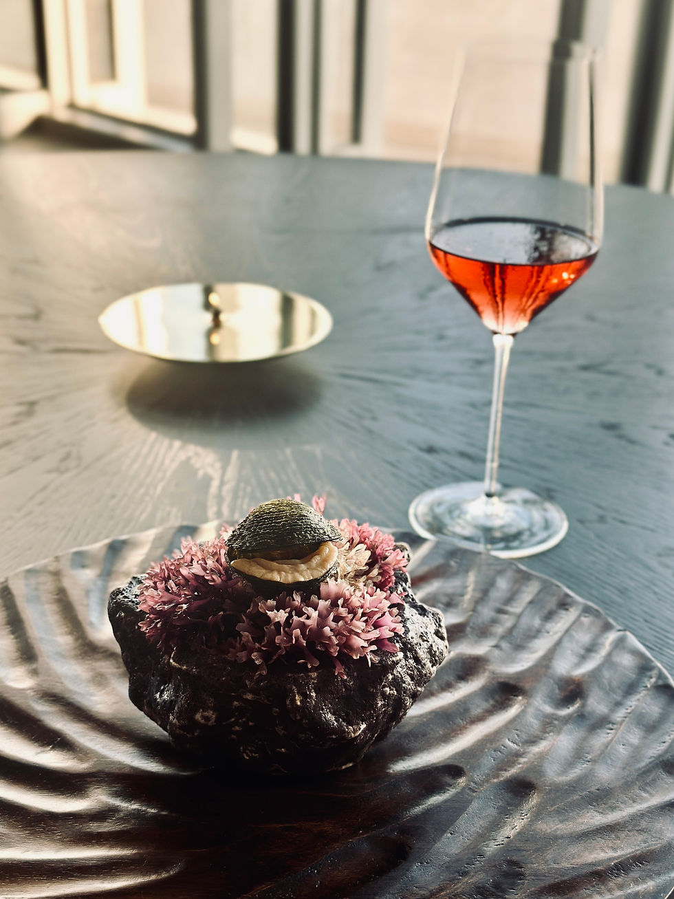 deep water smooth dam, seasoned with fermented tomato water and served with a seafood emulsion