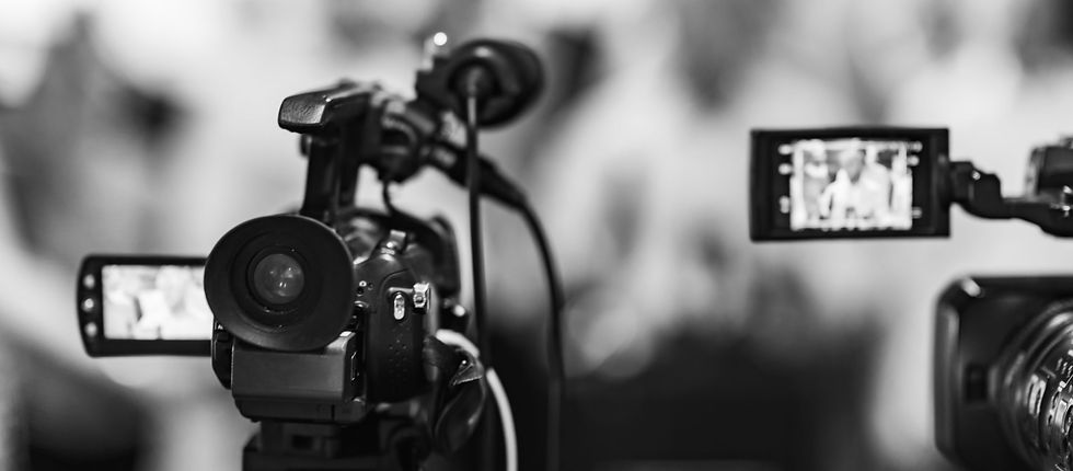 camera-at-media-conference-PCMUVRT-scaled.jpg