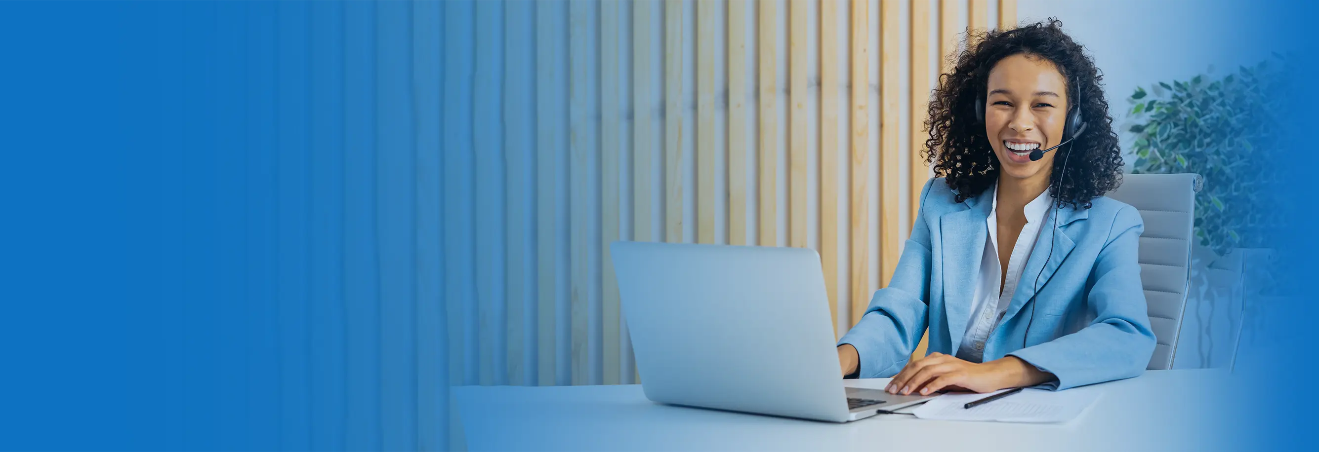businesswoman-sitting-at-computer-desk-in-the-offi-2022-02-04-18-56-04-utc copy.webp