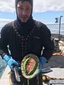 Tyronne Craig in ironskinn with giant greenlip abalone