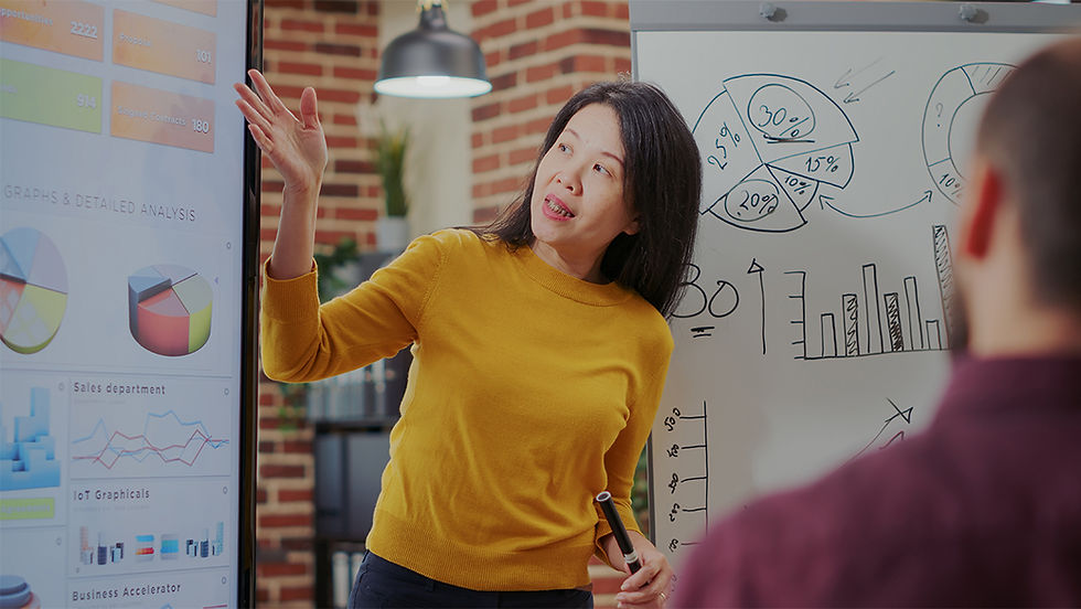 Woman presenting at marketing meeting.