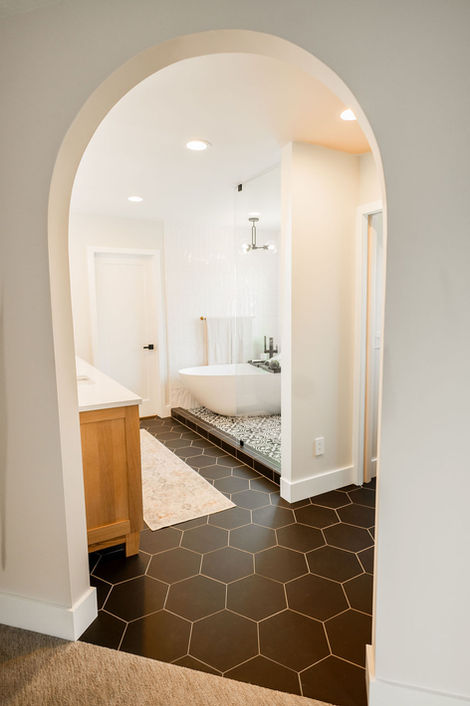 a bathroom with a tub and a walk in shower