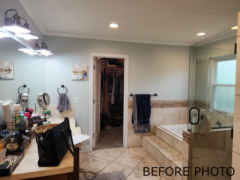 a before photo of a bathroom with a walk in closet