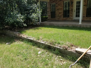 Wood forms set along a front flower bed for new concrete – Good Deal Builder, Dallas TX