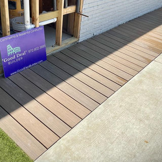 Composite decking strip installed along a house – Good Deal Builder, Dallas TX
